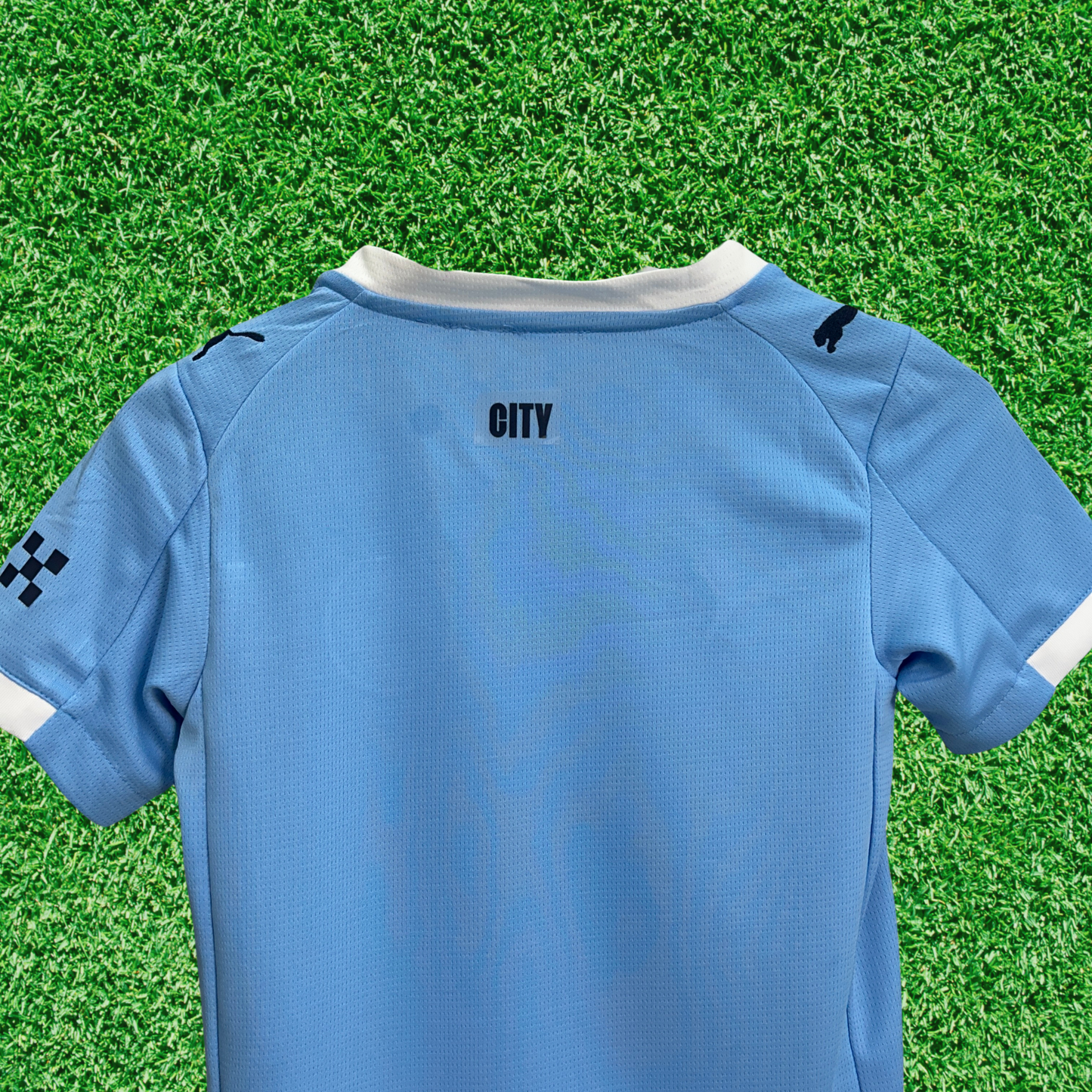 Kit infantil del Manchester City I 25/26